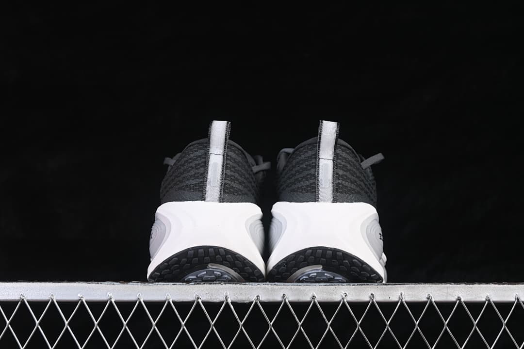 Rear view of the pair showing heel pull tabs and black tread.