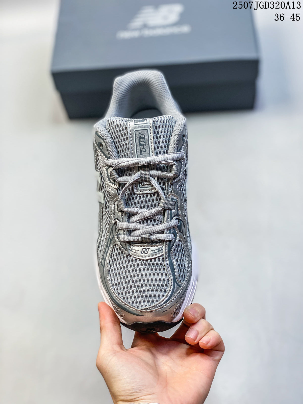 Front view of a silver mesh New Balance 740 sneaker