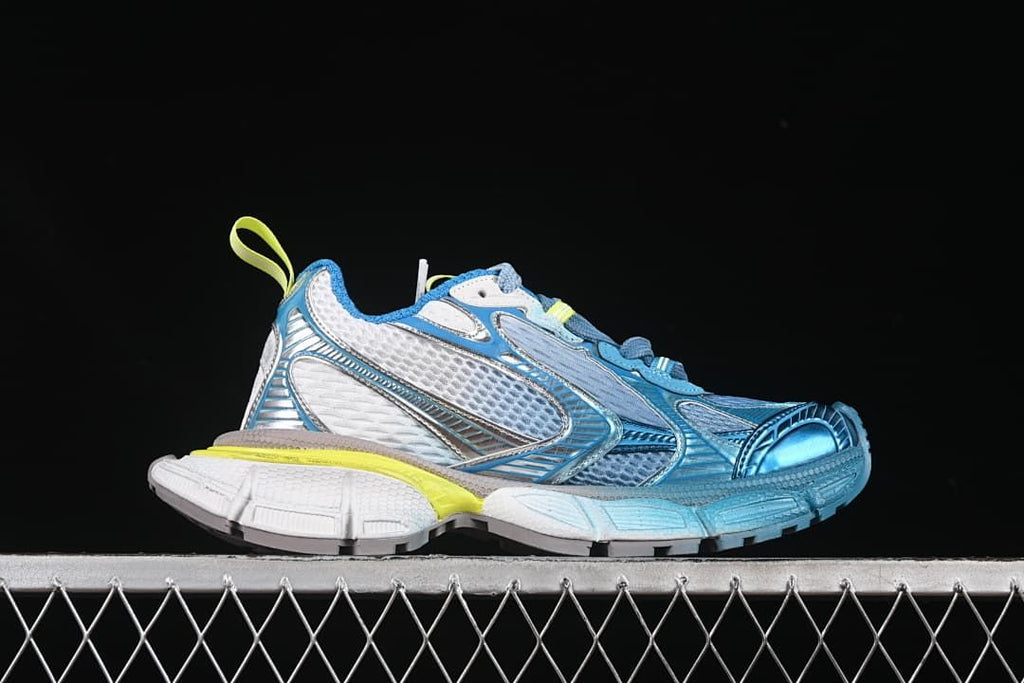 Side profile of the sneaker with blue, white, and yellow-green accents