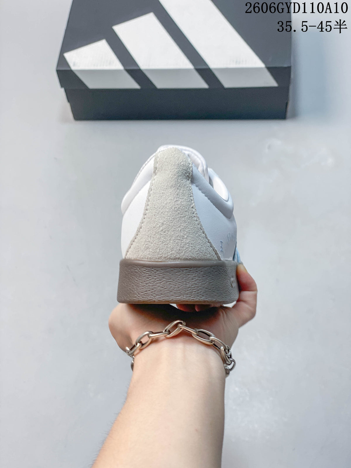Rear view of the sneaker with a suede-look heel panel and brown outsole