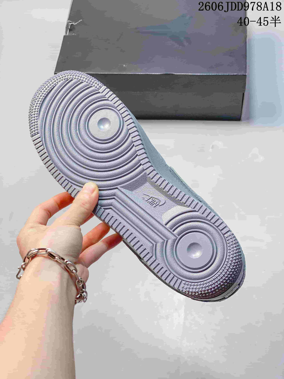 Close-up of the patterned outsole on a Nike Air Force 1 sneaker