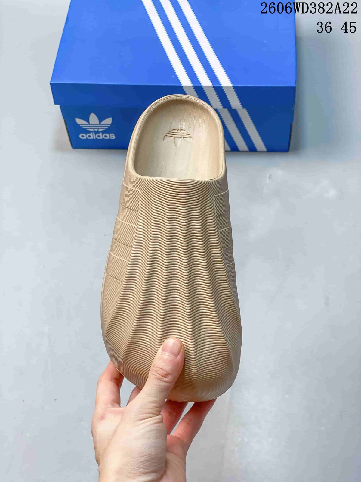 Top view of a beige closed-toe clog with ribbed texture