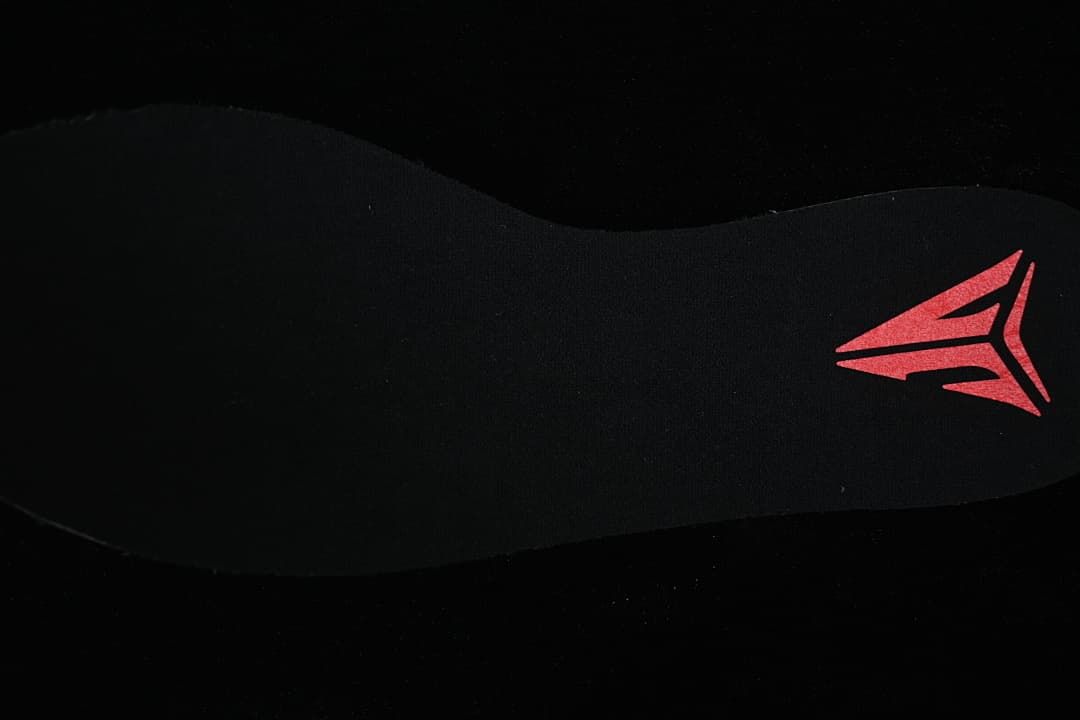 Close-up of the black insole with a colored graphic.