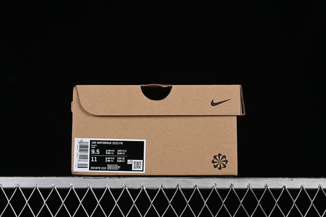 Shoe box label identifies Air VaporMax 2023 FK, black color, and style code DV1678-010; sample size shown.