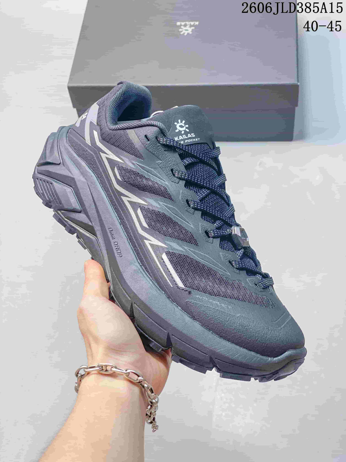 Dark charcoal Kailas C4 trail running shoe with a sculpted midsole.