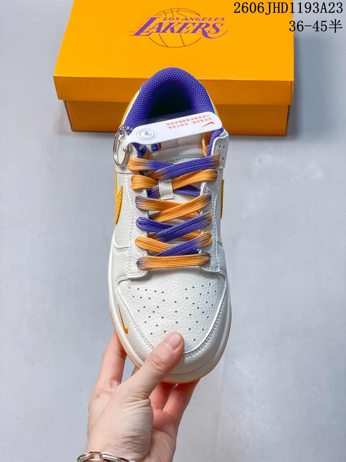 Top view showing perforated toe, purple collar, and gold-and-purple laces