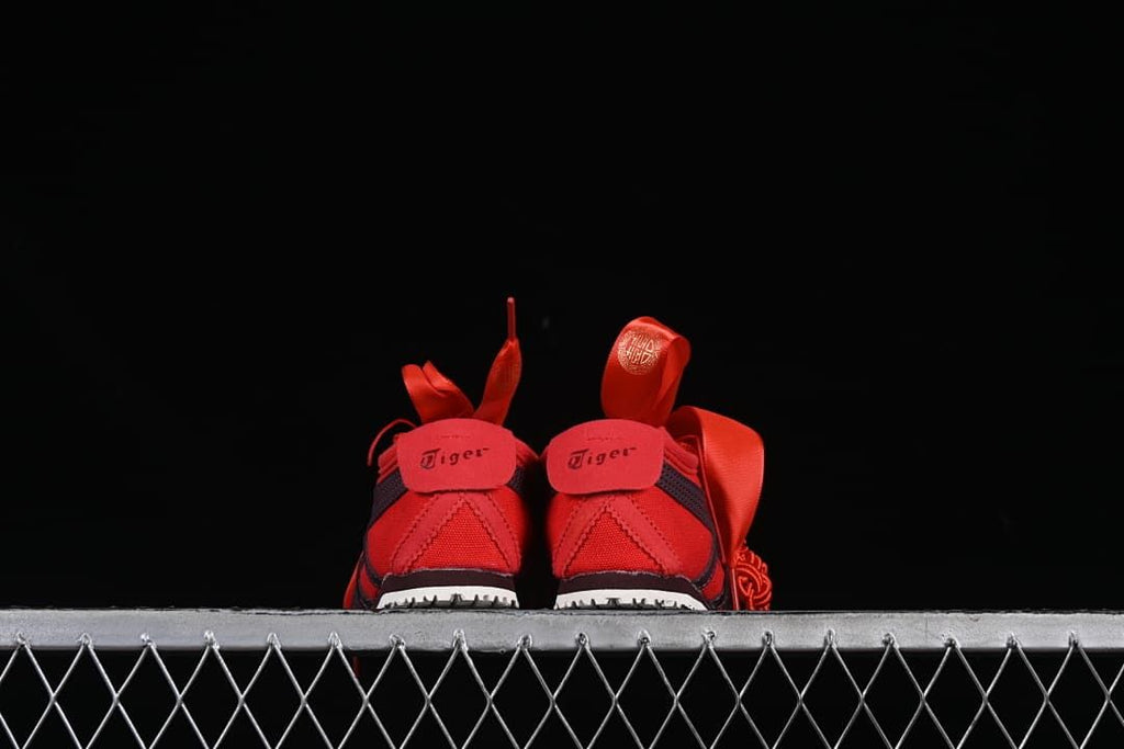 Rear view of the pair of red sneakers