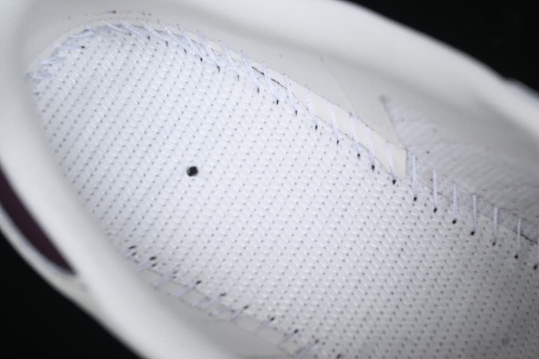Close-up of the perforated white shoe lining