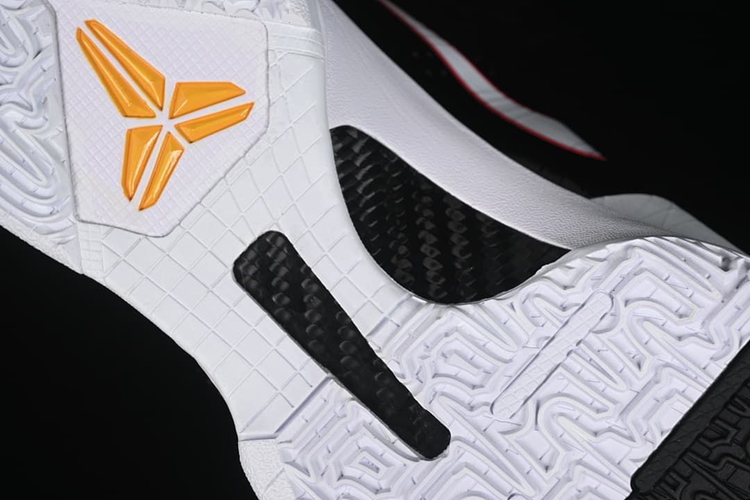 Close-up of the white outsole with black insert and yellow Kobe logo