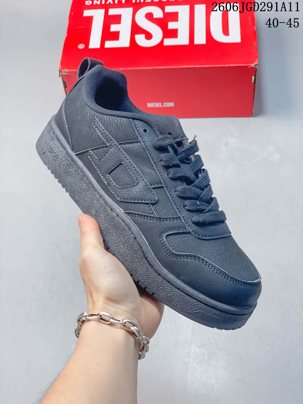 Angled side view of a dark gray low-top sneaker with tonal layered panels