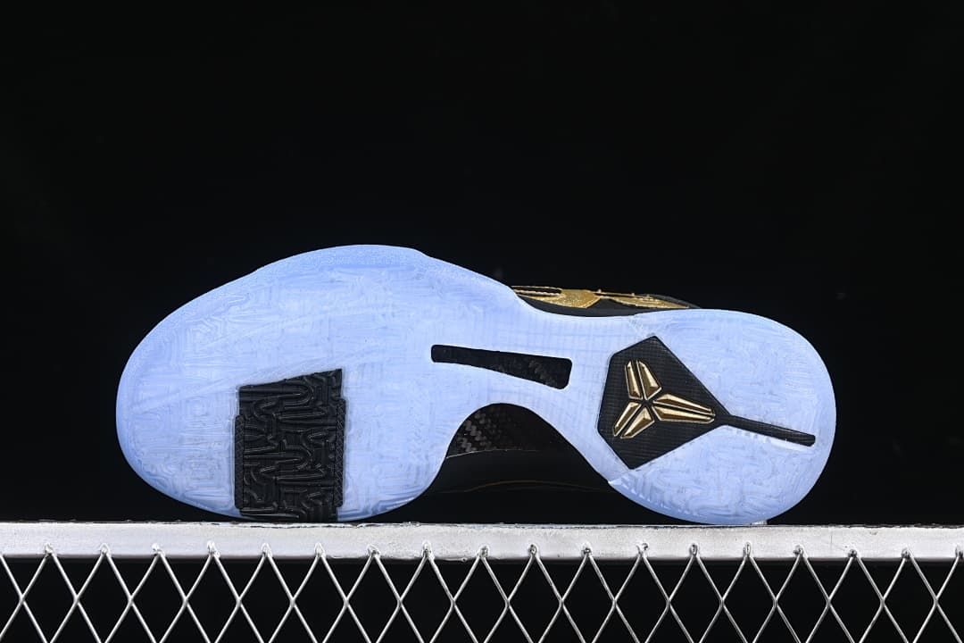 Underside of the shoe showing the pale blue patterned outsole and black traction sections