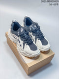 Pair of navy and off-white Onitsuka Tiger sneakers shown from the front on a shoebox.
