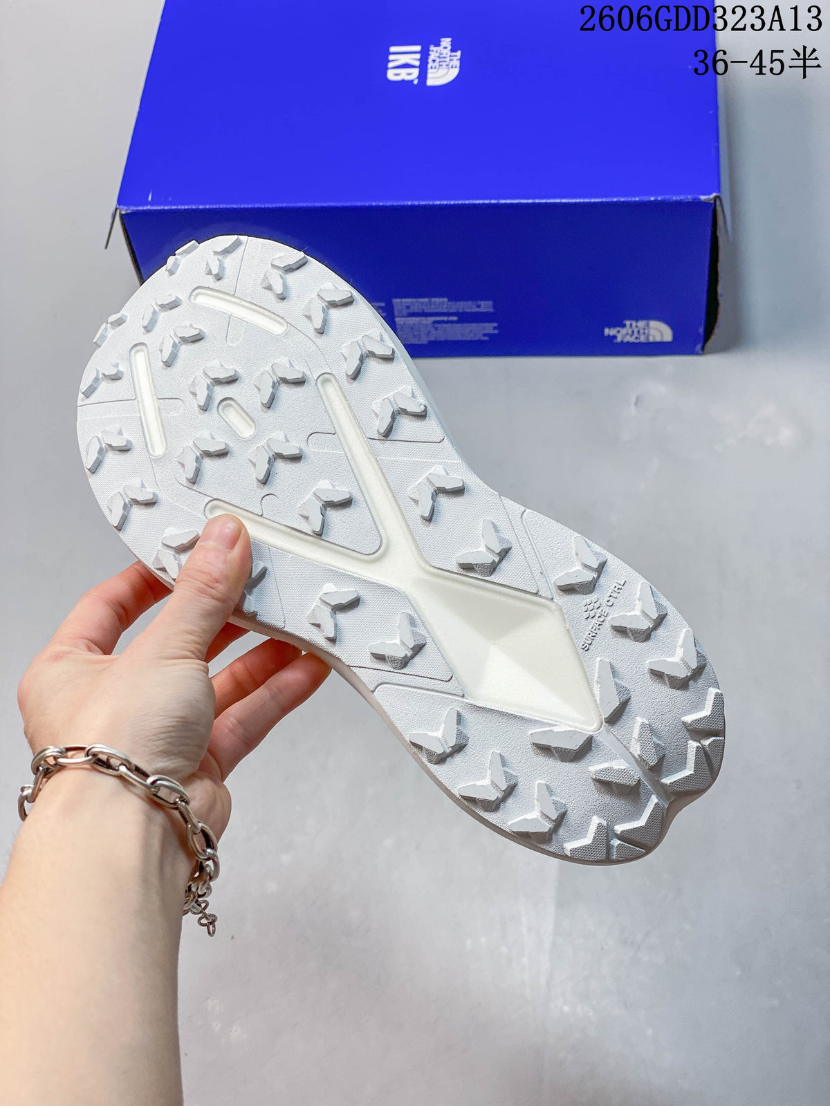 Close view of the white lugged outsole on the adidas running shoe