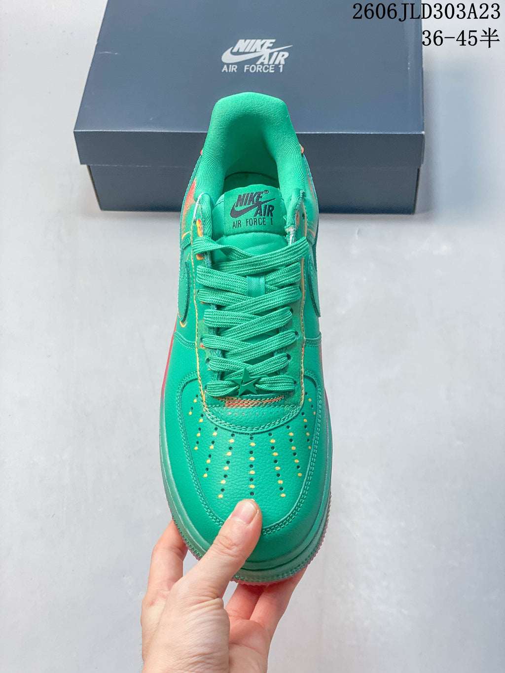 Top view of the green perforated toe and matching laces on the Air Force 1 sneaker