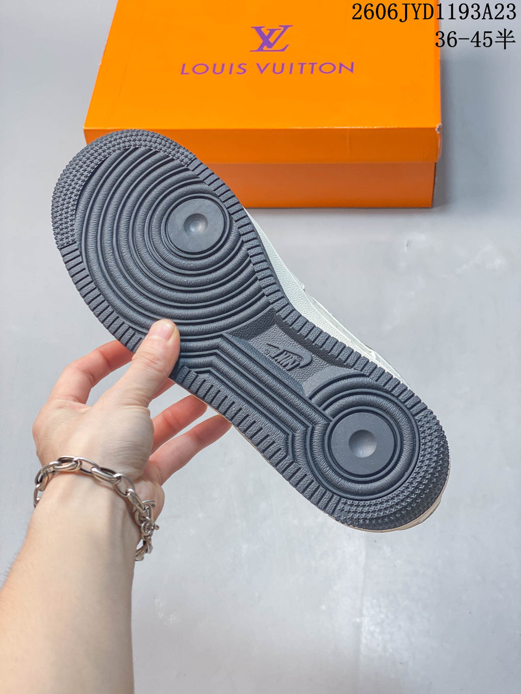 Close-up of the dark textured outsole and circular tread pattern.