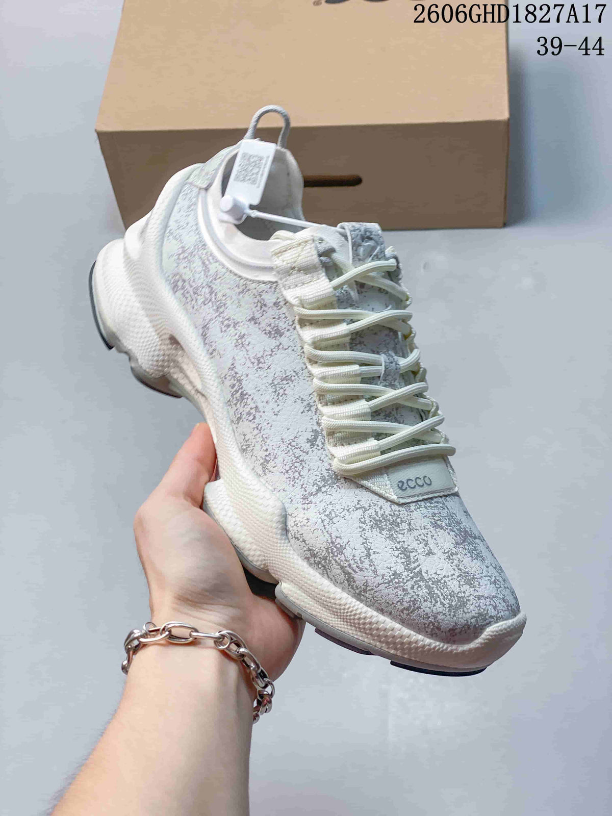 Angled view of the patterned sneaker, with its light upper and sculpted sole visible.
