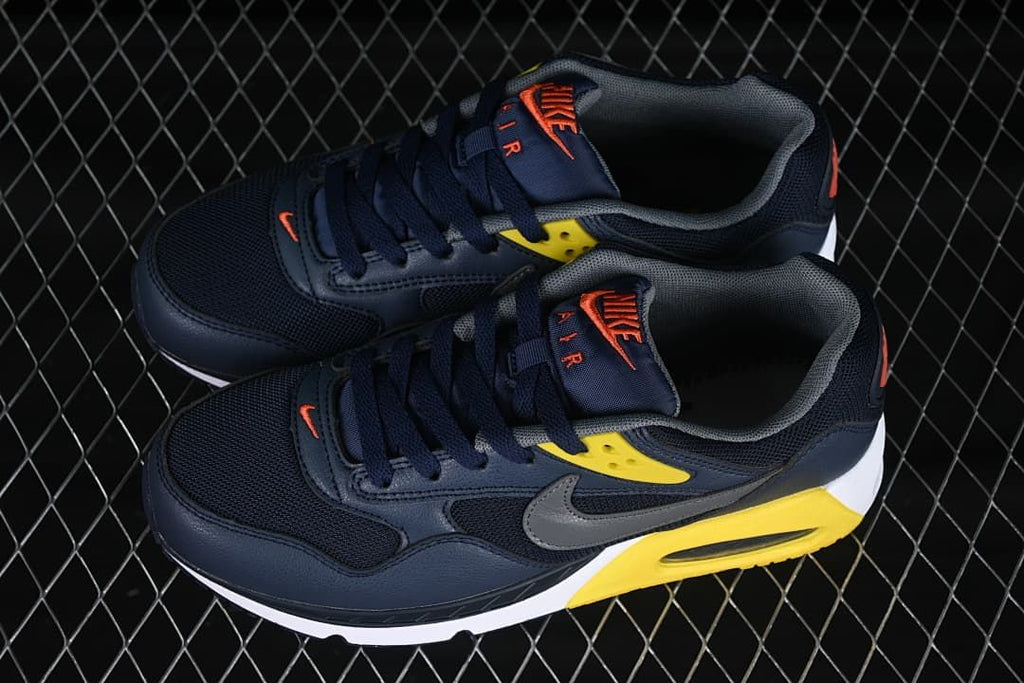 Pair of navy Nike Air Max Correlate sneakers viewed from above.