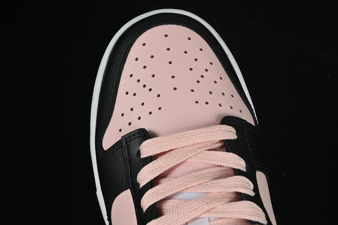 Top view of the perforated pale pink toe and pink laces