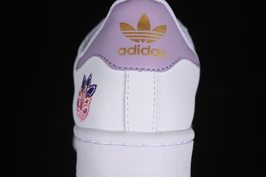 Rear view showing the lavender heel panel and embroidered heel detail