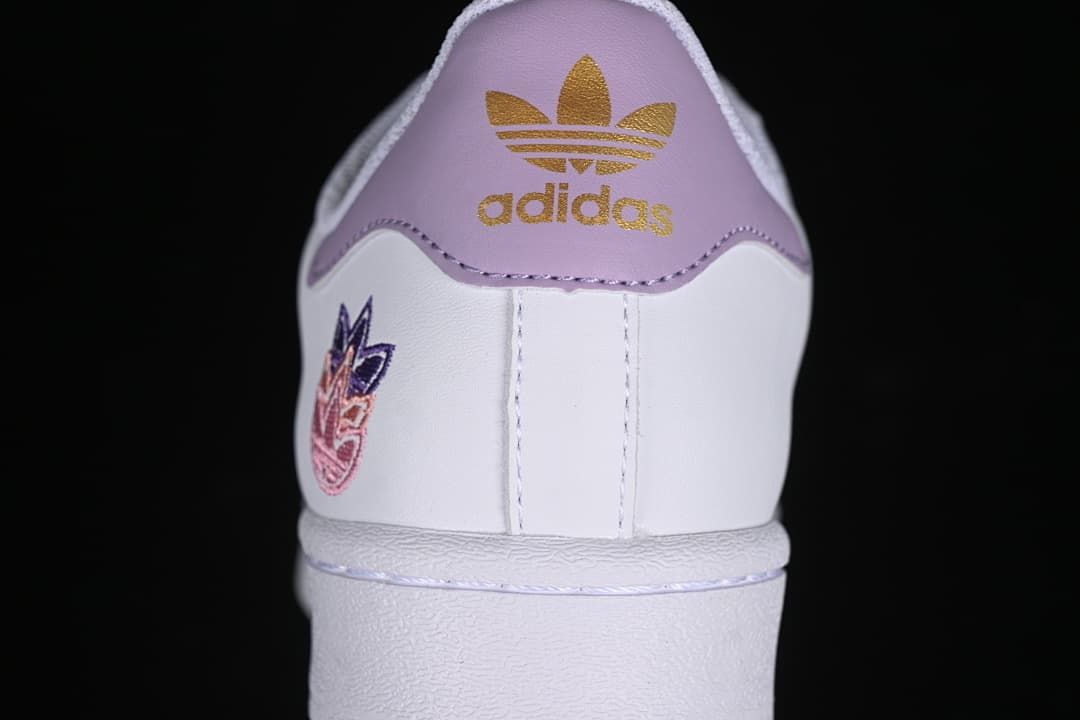 Rear view showing the lavender heel panel and embroidered heel detail