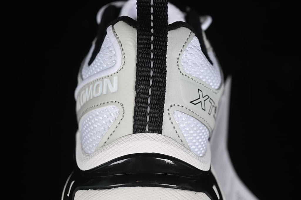 Rear view highlighting the heel pull tab, mesh panels, and XT-6 branding.