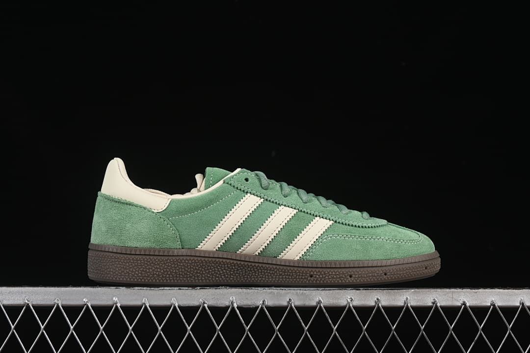 Side profile of a green Handball Spezial sneaker with cream stripes