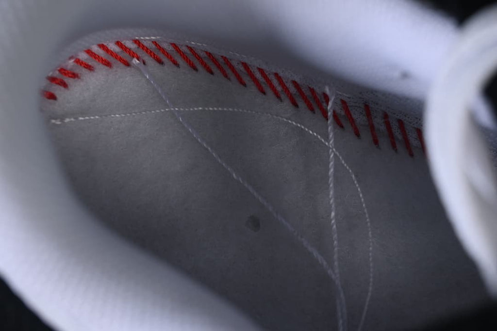 Close-up view inside the sneaker showing stitching and lining.