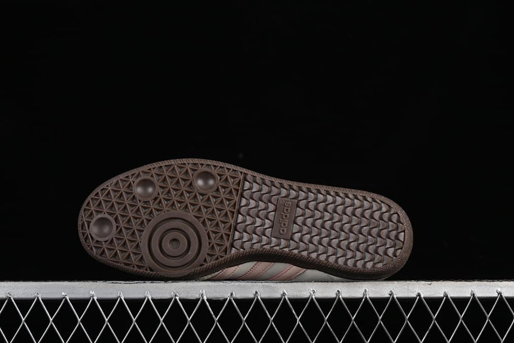 Underside of the dark brown outsole with patterned tread