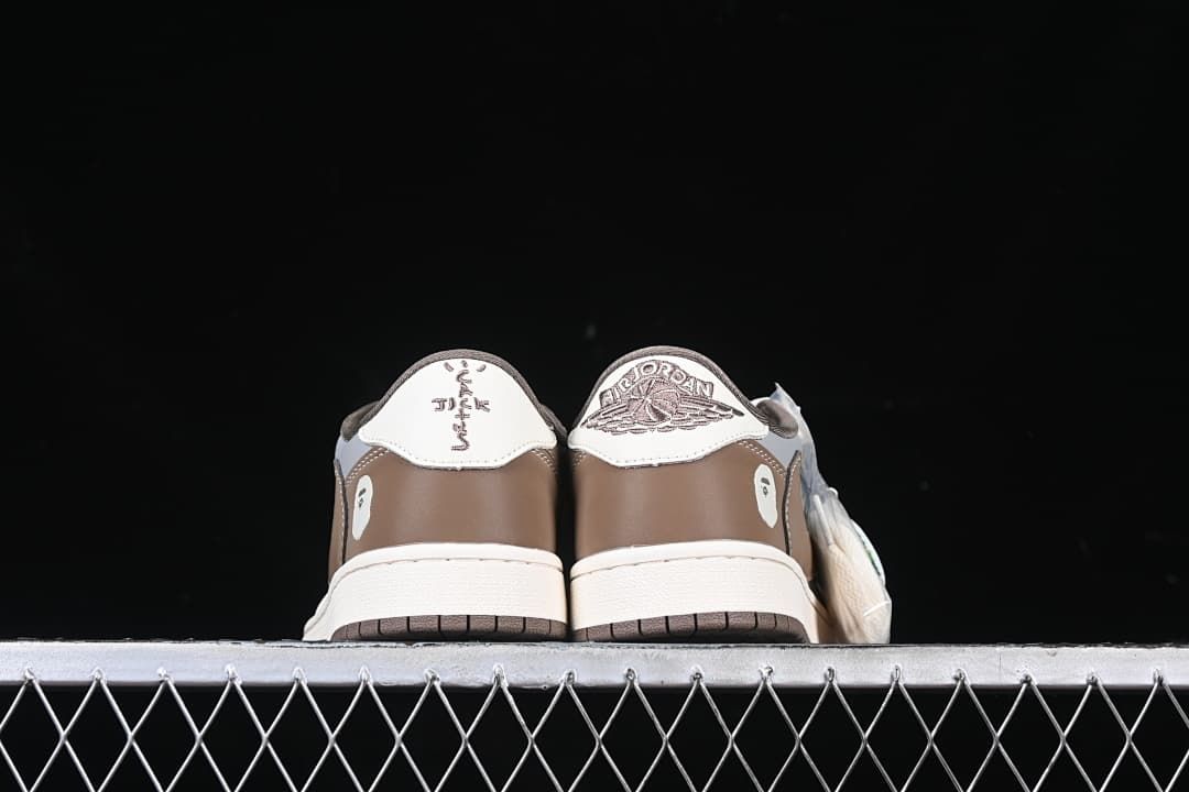 Rear view of both shoes showing contrasting heel embroidery.