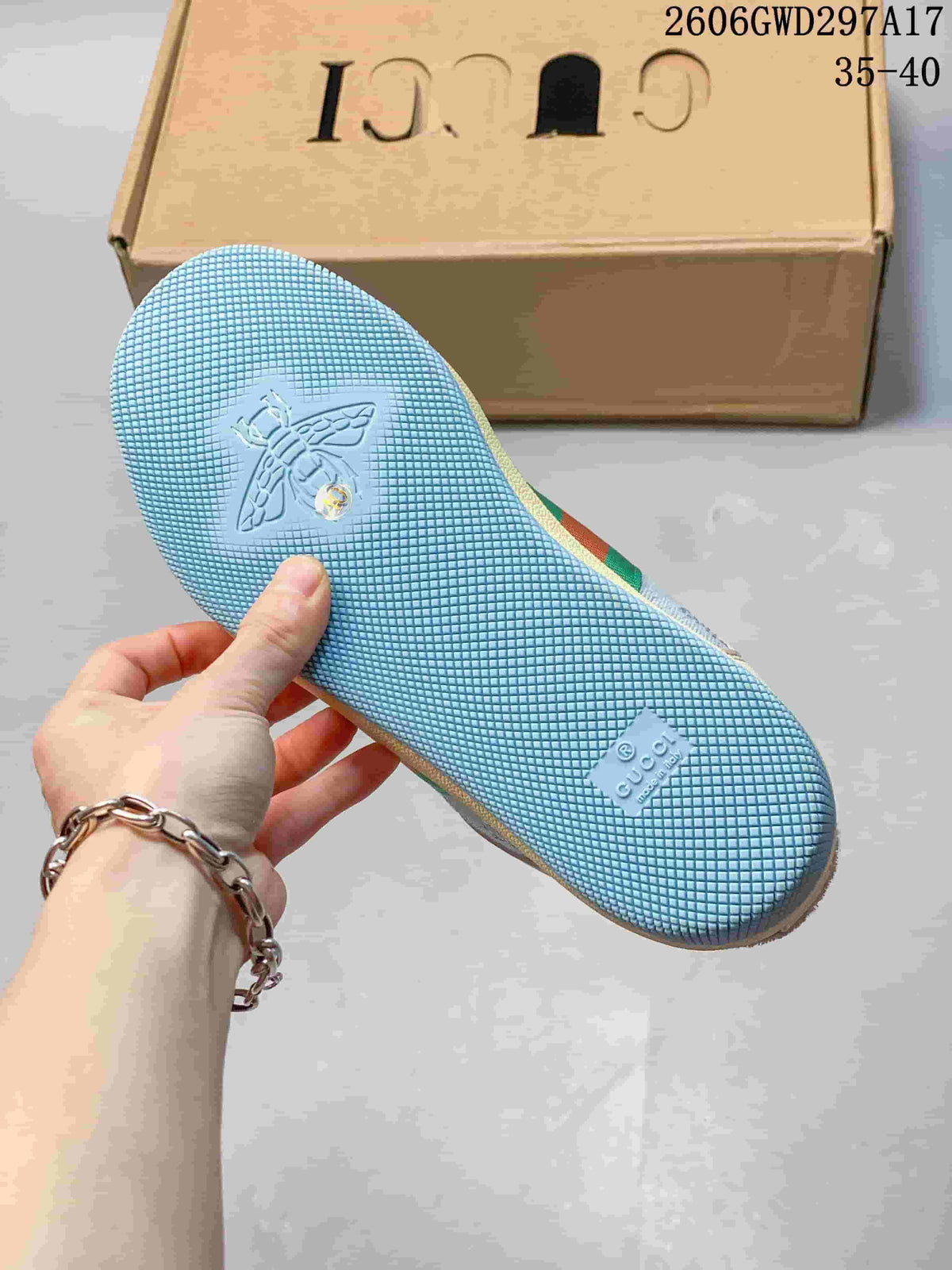 Close-up of the blue textured outsole on a Gucci Screener-style sneaker