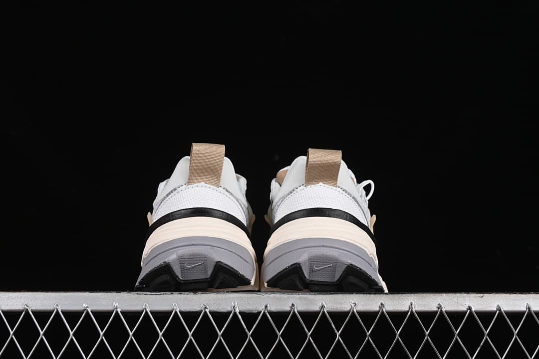 Rear view of the pair showing heel details and outsole sections.
