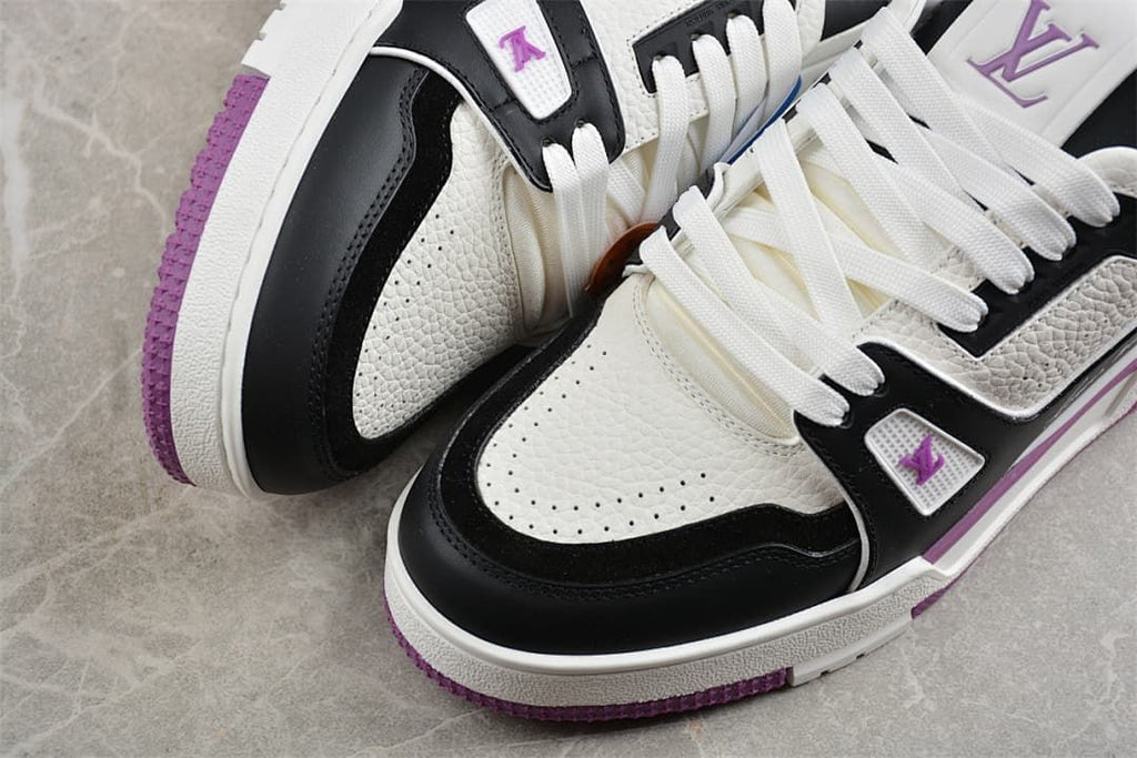 Close-up of perforated white toe panels, black overlays, and purple outsole details
