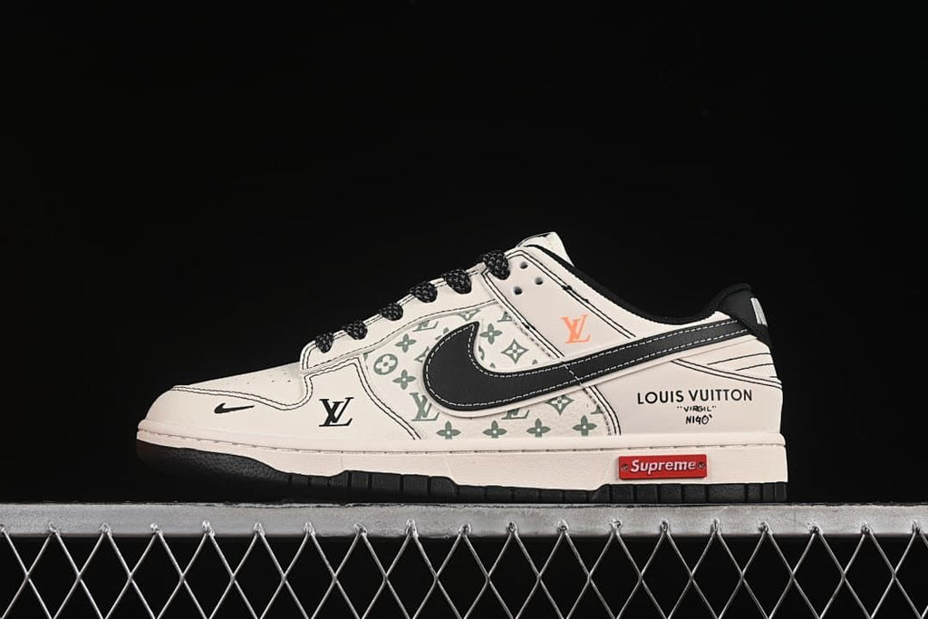 Side profile of a cream and black low-top sneaker with green patterned panels and visible branding.