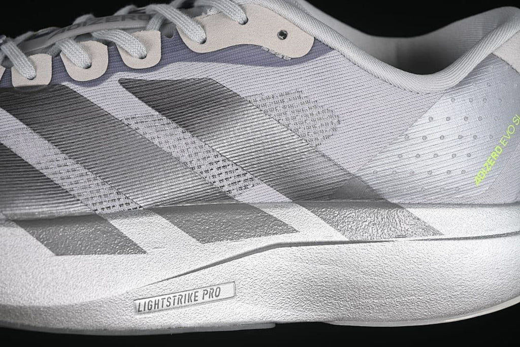 Close-up of the gray upper, dark stripes, and Lightstrike Pro marking on the midsole.