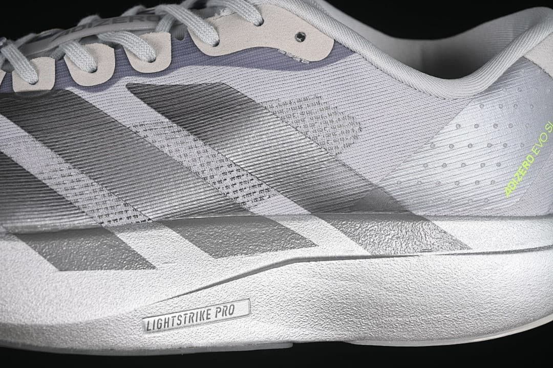 Close-up of the gray upper, dark stripes, and Lightstrike Pro marking on the midsole.