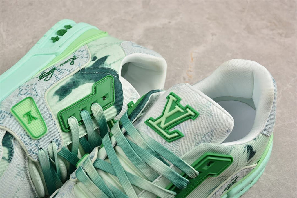 Close-up of the sneaker tongue, lacing, collar, and green decorative accents.