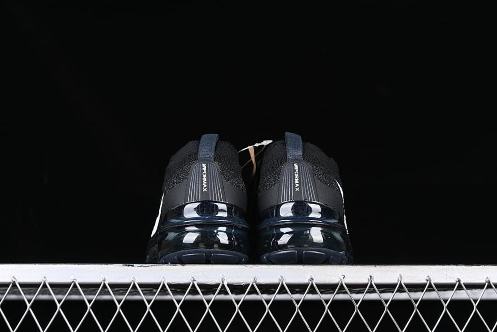 Rear view of the pair showing heel branding and visible cushioned soles.