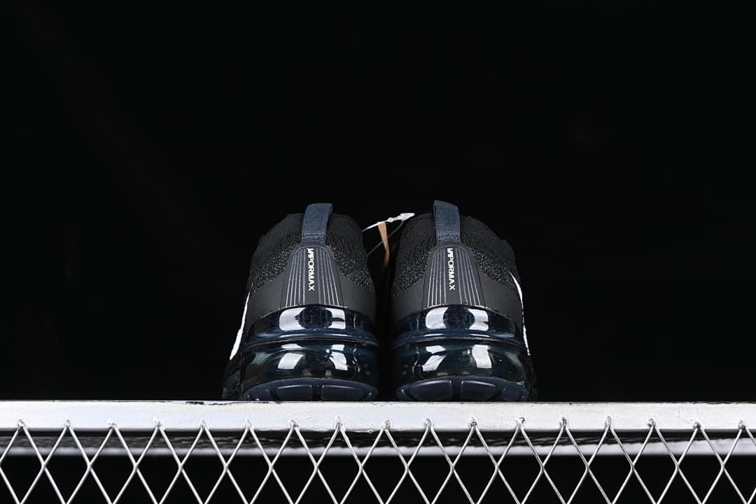 Rear view of the pair showing heel branding and visible cushioned soles.