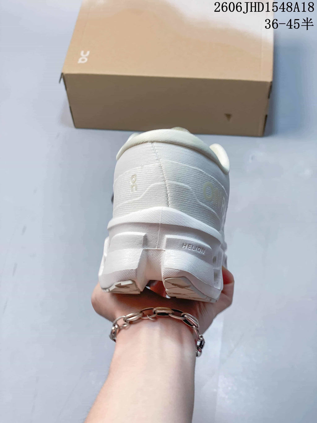 Rear view showing the heel and sculpted sole of a white sneaker