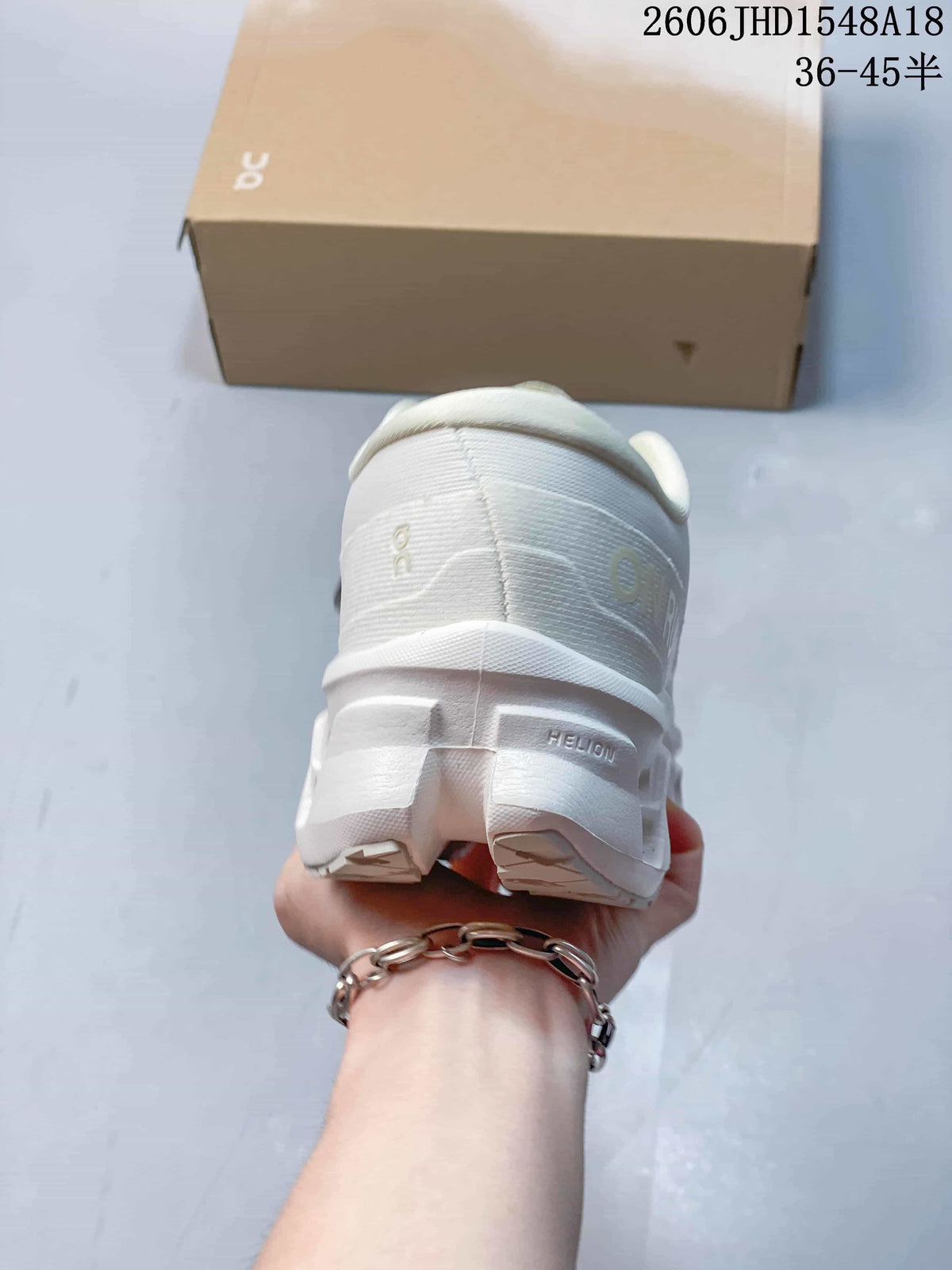 Rear view showing the heel and sculpted sole of a white sneaker