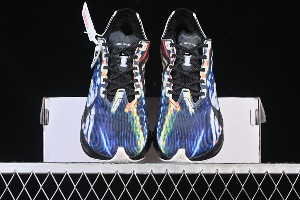 Front view of the pair showing multicolor toe panels and black laces
