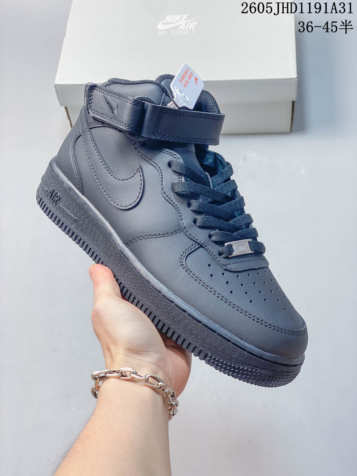 Side view of a dark navy high-top sneaker with a lace-up front and ankle strap