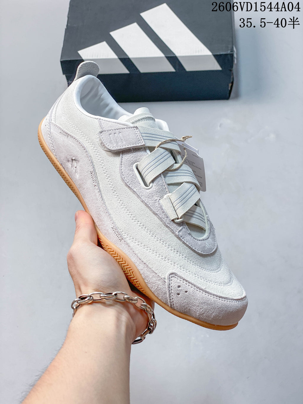 Angled view of the light-colored adidas Urban Reverie low-top sneaker