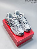 Pair of white and black New Balance AC Runner shoes on a red shoebox