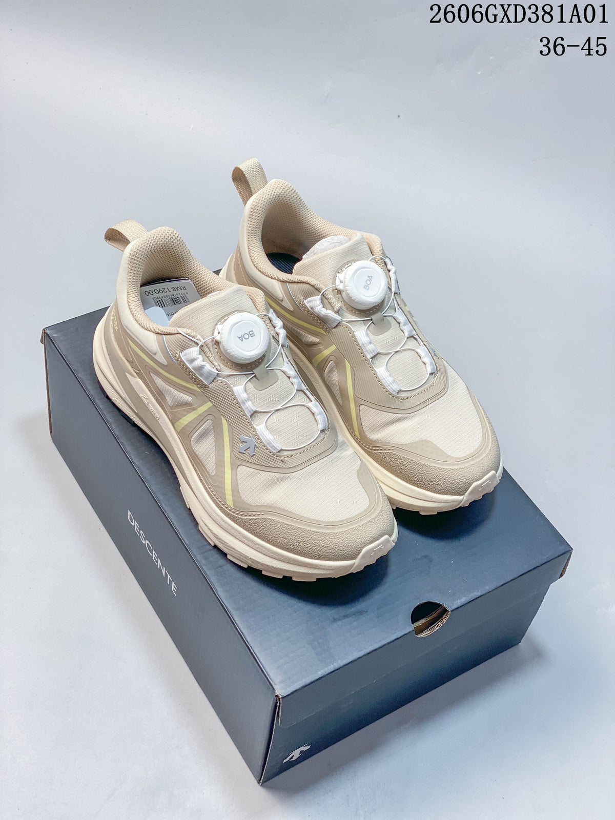 Pair of beige DESCENTE LAVITATE WIRE 3.0 sneakers with dial closures, shown on a shoe box