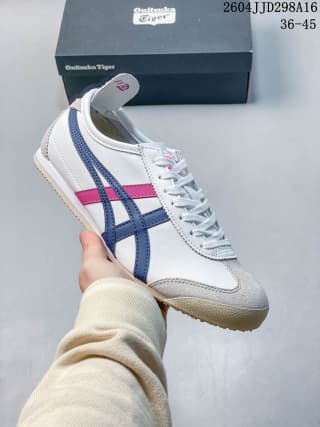 White Mexico 66 sneaker with dark blue and pink side stripes, shown with a branded shoe box.