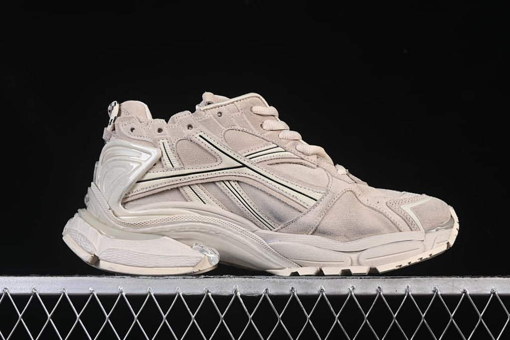Side profile showing the layered upper and sculpted sole