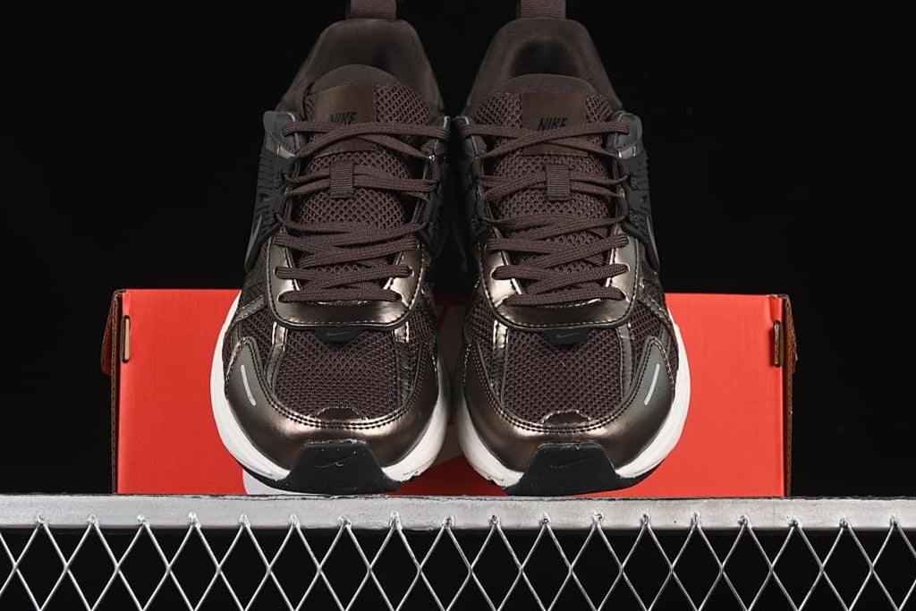 Front view of the pair showing the laces, mesh-look panels, and contrasting soles