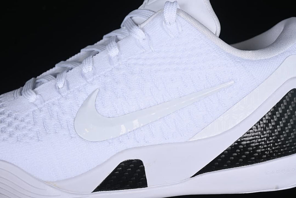 Close-up of the white textured upper, side swoosh and black heel panel