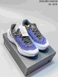 Pair of purple, white, and yellow Kailas FUGA trail shoes with dial-adjusted lacing.